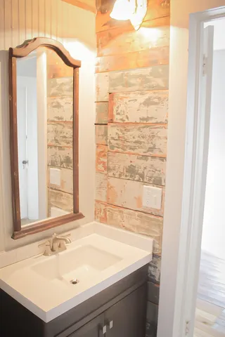 a bedroom with a bed and a shower