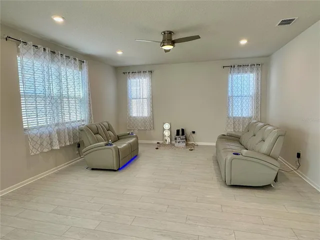 a living room with furniture and a window