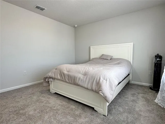 a large bed sitting in a room