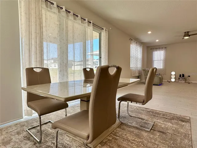 a view of a livingroom with furniture and lounge chair