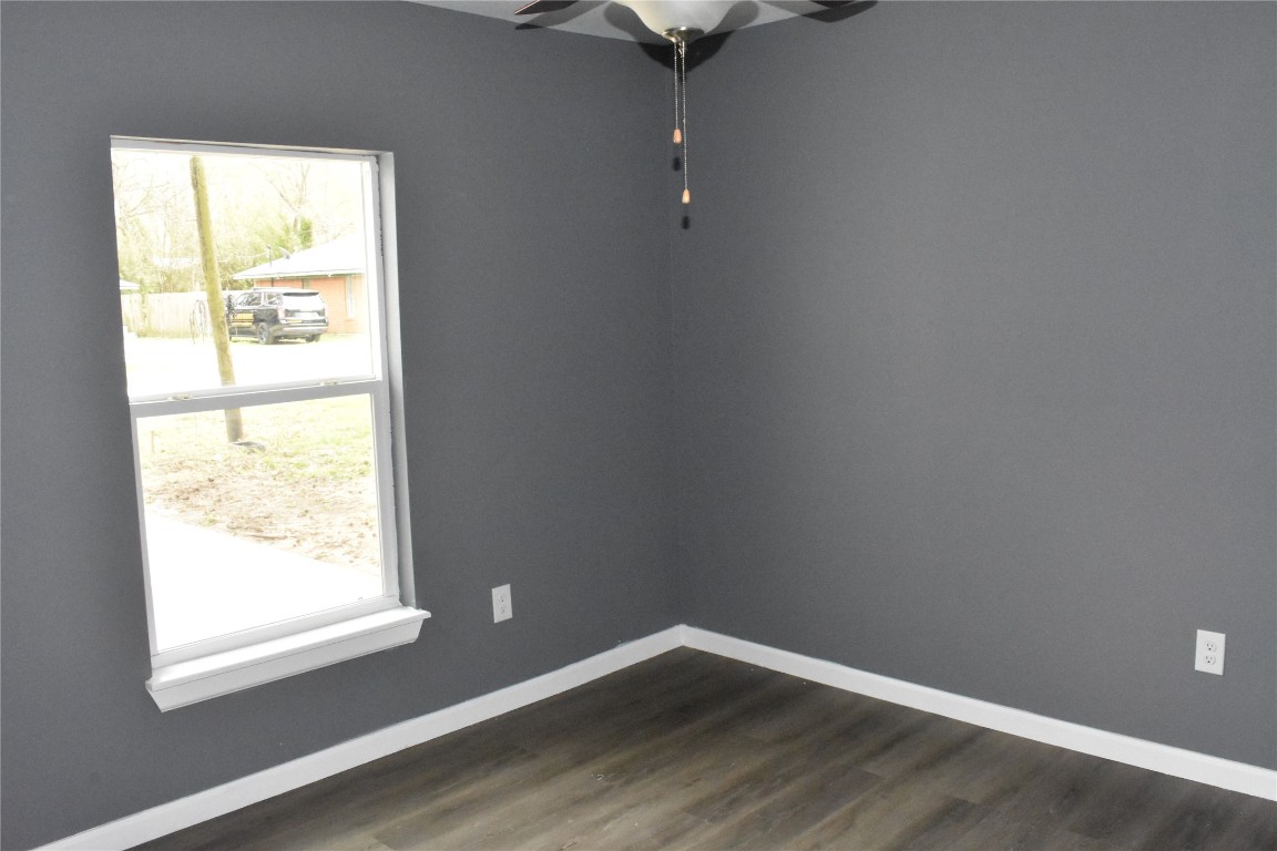 204 Texas Daisetta, TX 77533 - Photo 12 of 21 a view of an empty room with wooden floor and a window