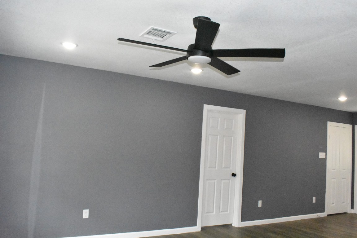 204 Texas Daisetta, TX 77533 - Photo 6 of 21 an empty room with closet and wooden floor