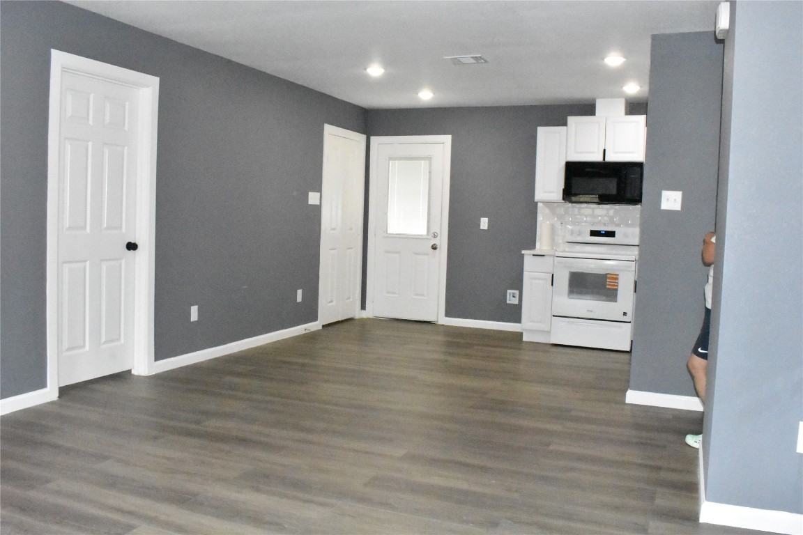204 Texas Daisetta, TX 77533 - Photo 7 of 21 a view of a kitchen with a sink and a refrigerator