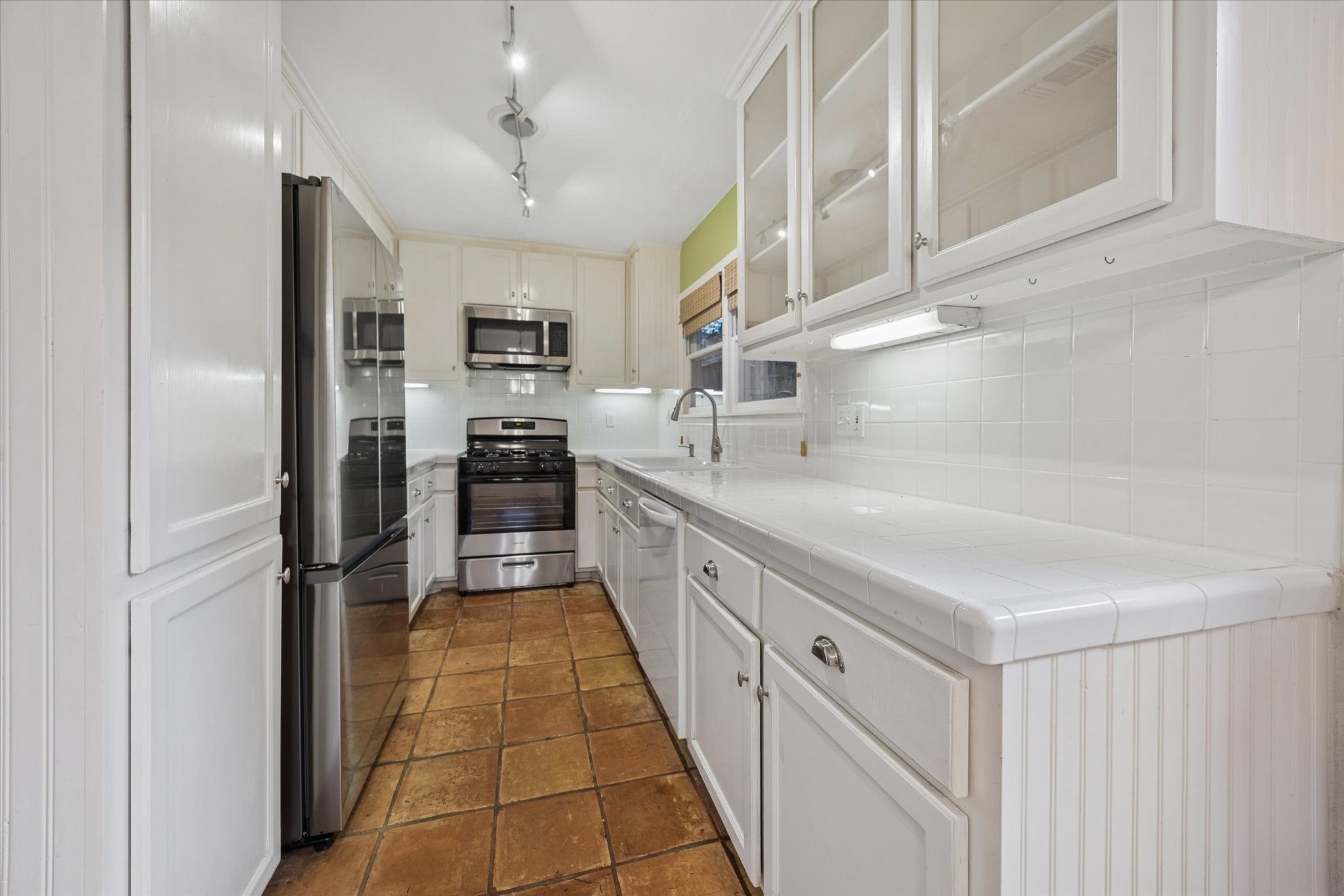 1931 Bissonnet Street Houston, TX 77005 - Photo 7 of 22 a large white kitchen with cabinets