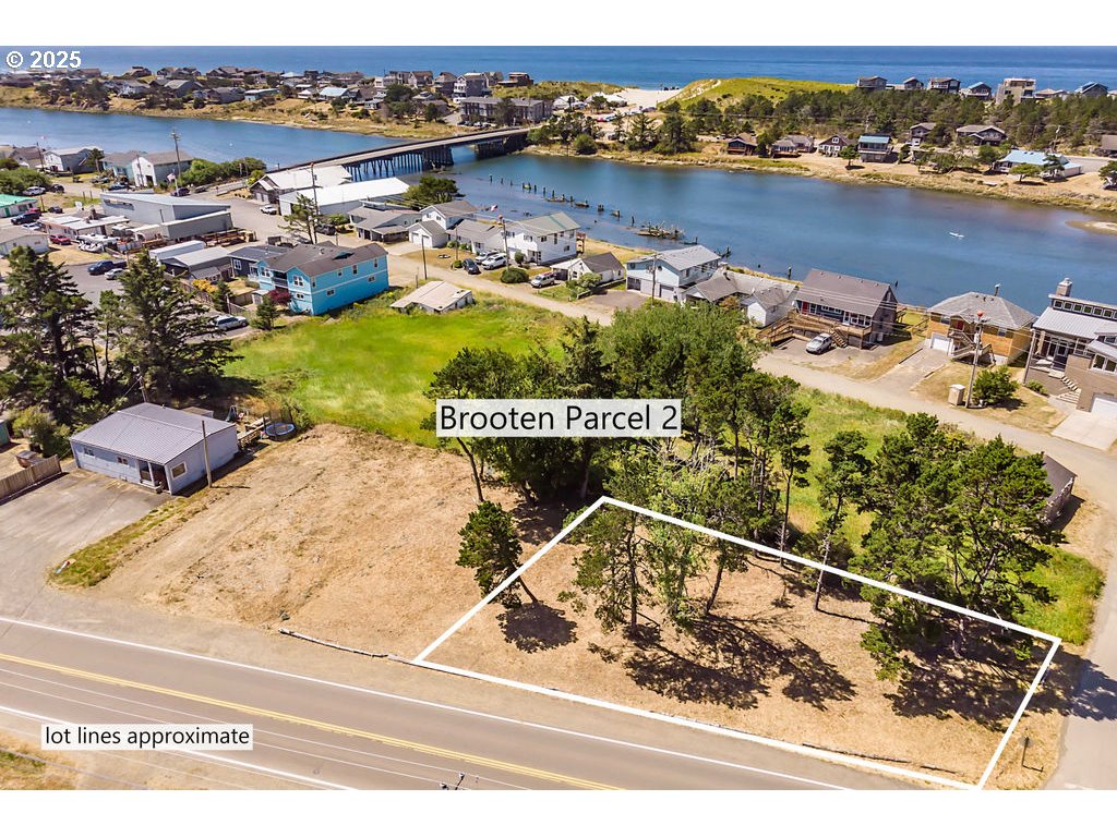 Brooten Road, Unit PARCEL2 Pacific City, OR 97135 - Photo 7 of 15 a view of a lake with a house