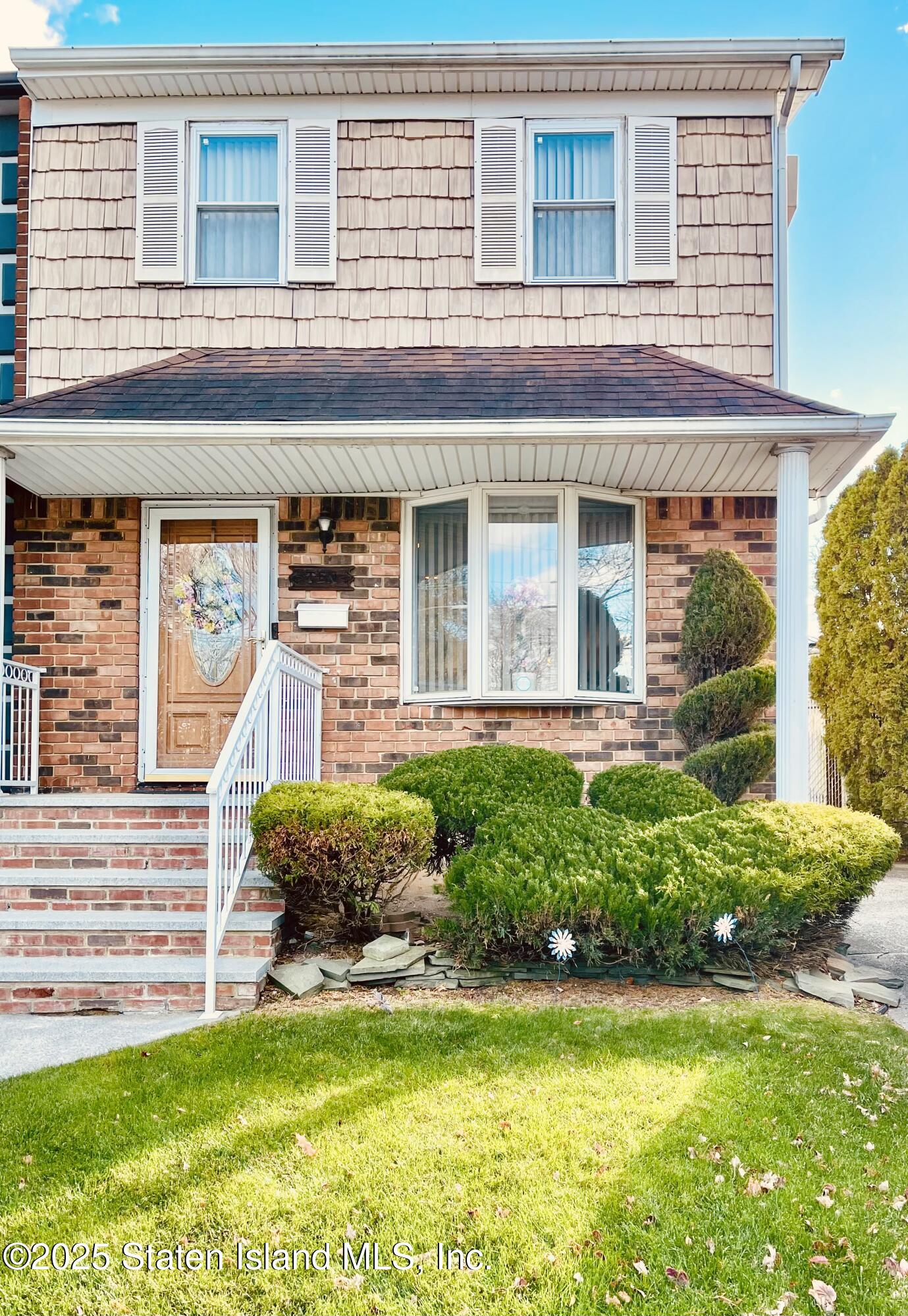 front view of a house with a yard