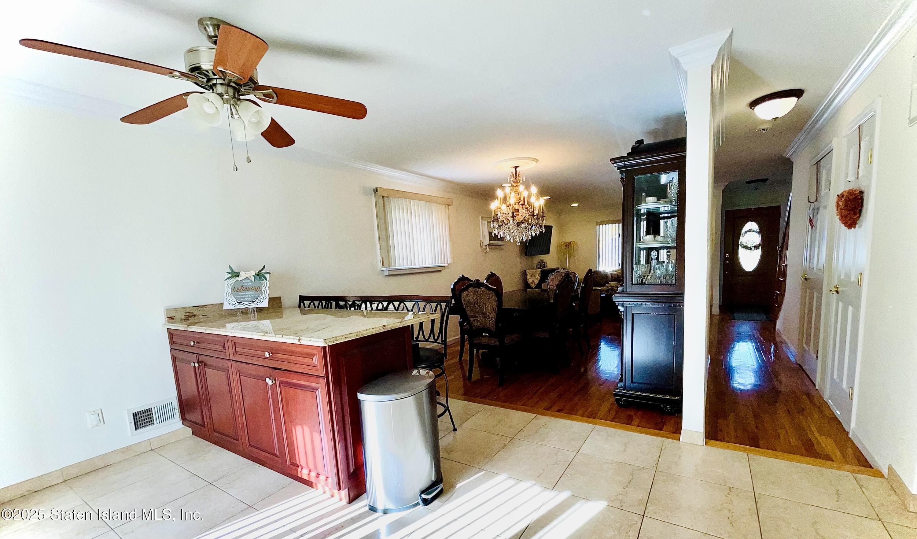 10 Token Street Staten Island, NY 10312 - Photo 12 of 39 a kitchen with stainless steel appliances granite countertop a stove top oven a sink a counter space and cabinets
