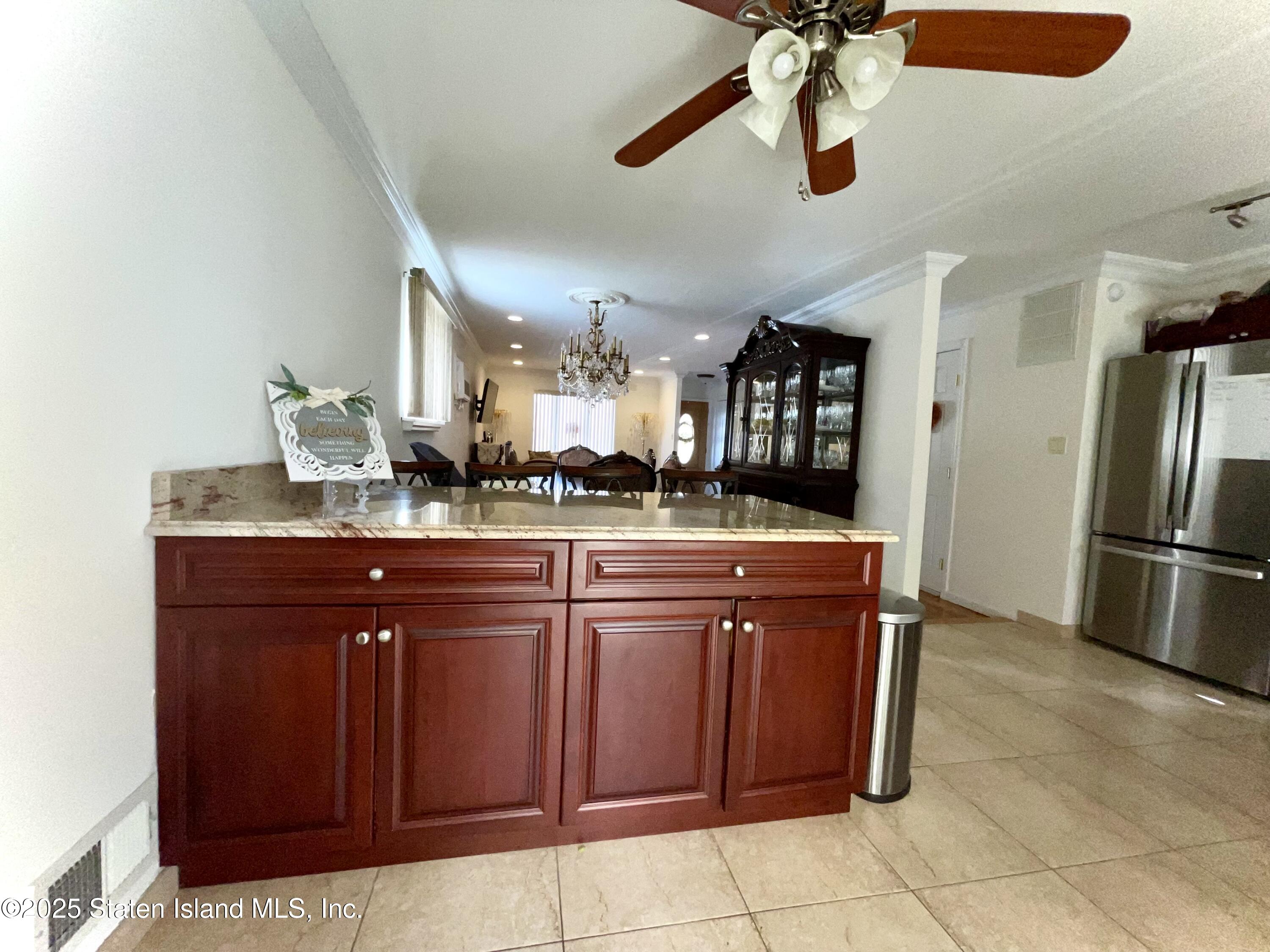 10 Token Street Staten Island, NY 10312 - Photo 13 of 39 a kitchen with stainless steel appliances granite countertop a refrigerator and a sink