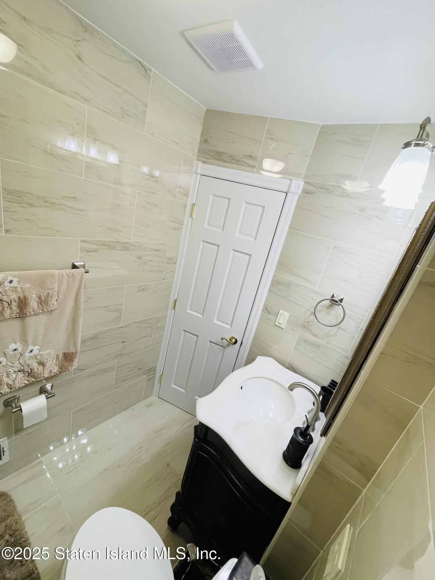 10 Token Street Staten Island, NY 10312 - Photo 20 of 39 a bathroom with a toilet and a shower