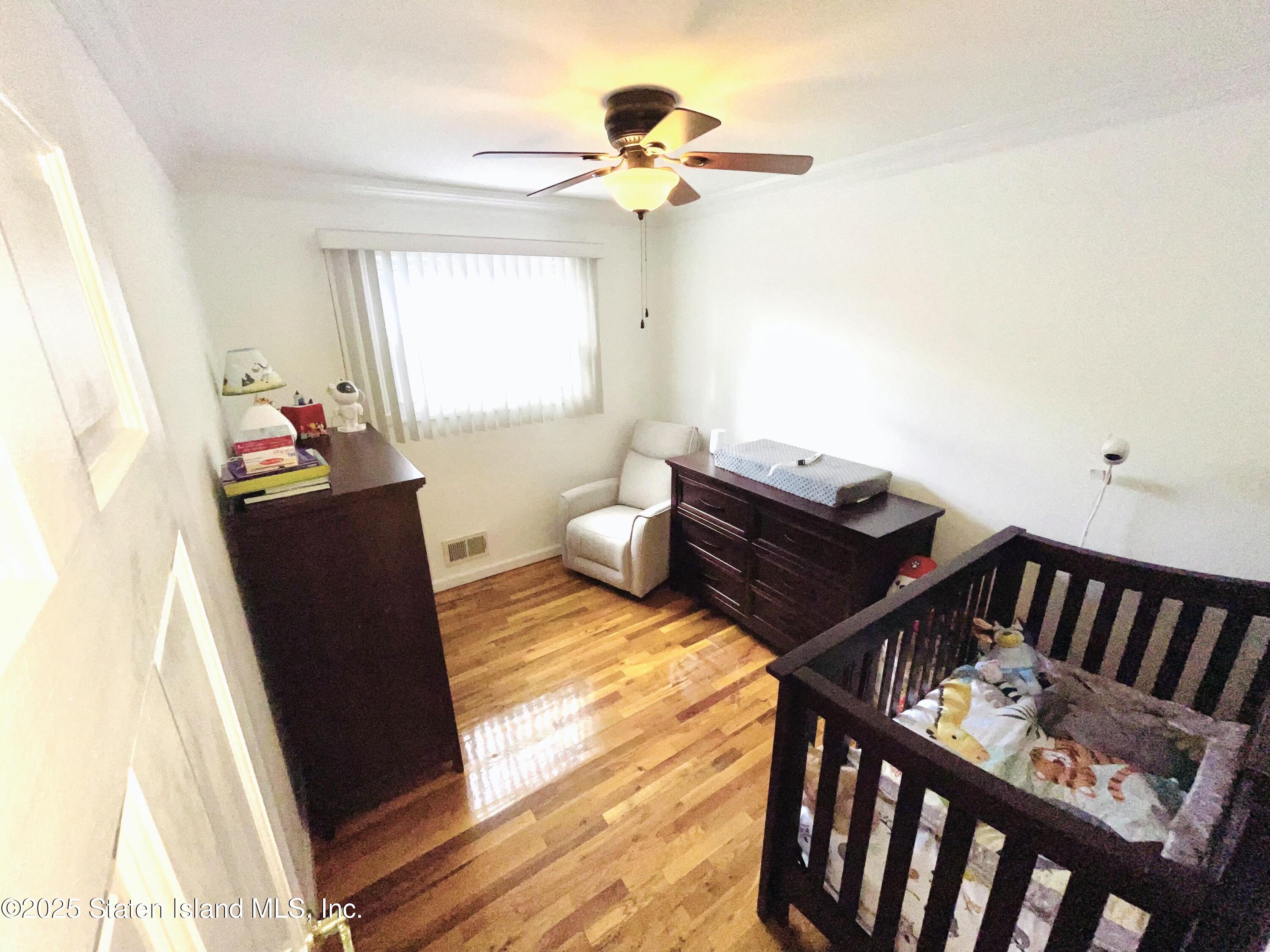 10 Token Street Staten Island, NY 10312 - Photo 21 of 39 a living room with furniture and a window
