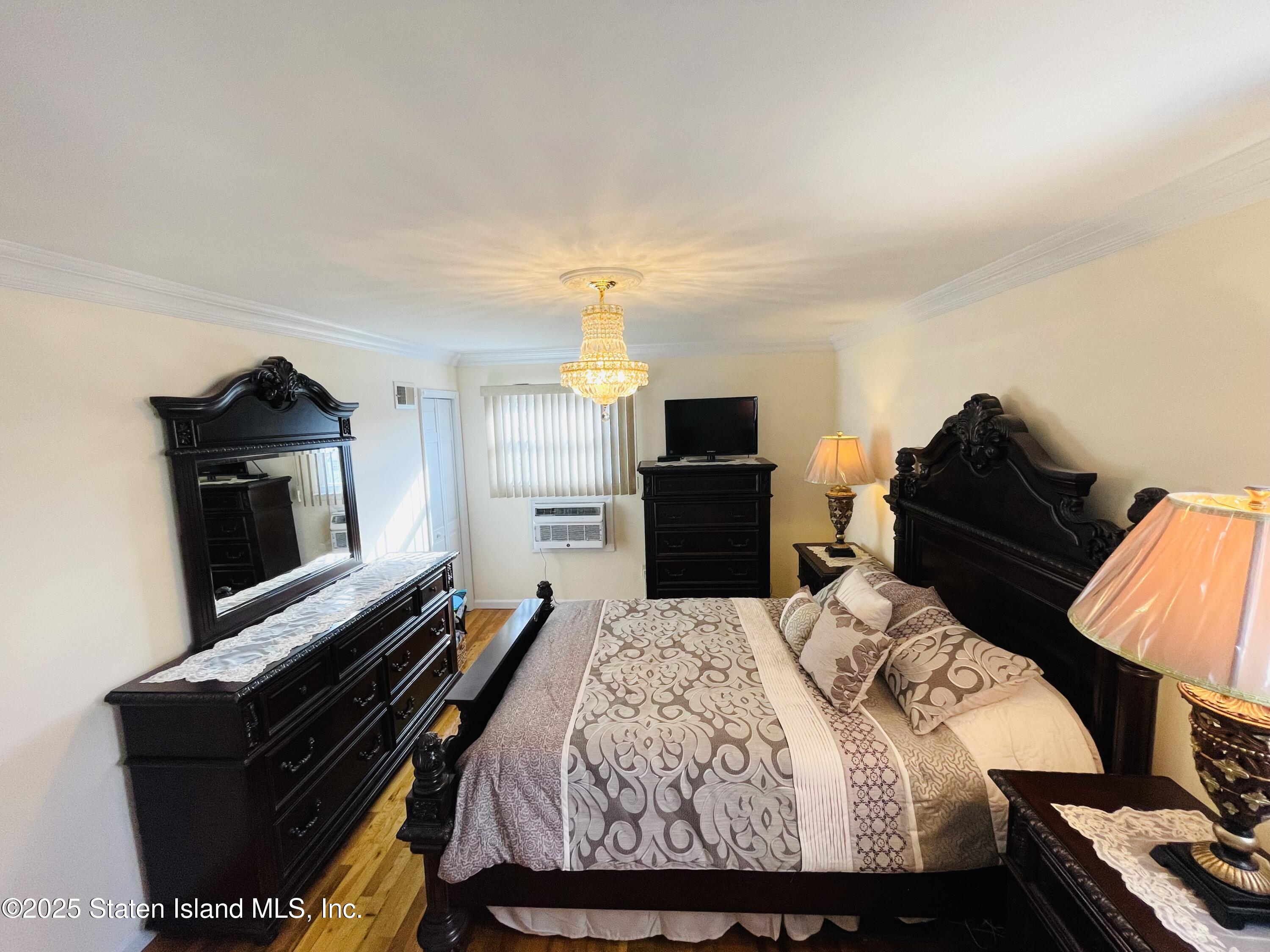 10 Token Street Staten Island, NY 10312 - Photo 28 of 39 a bedroom with a bed and flat screen tv