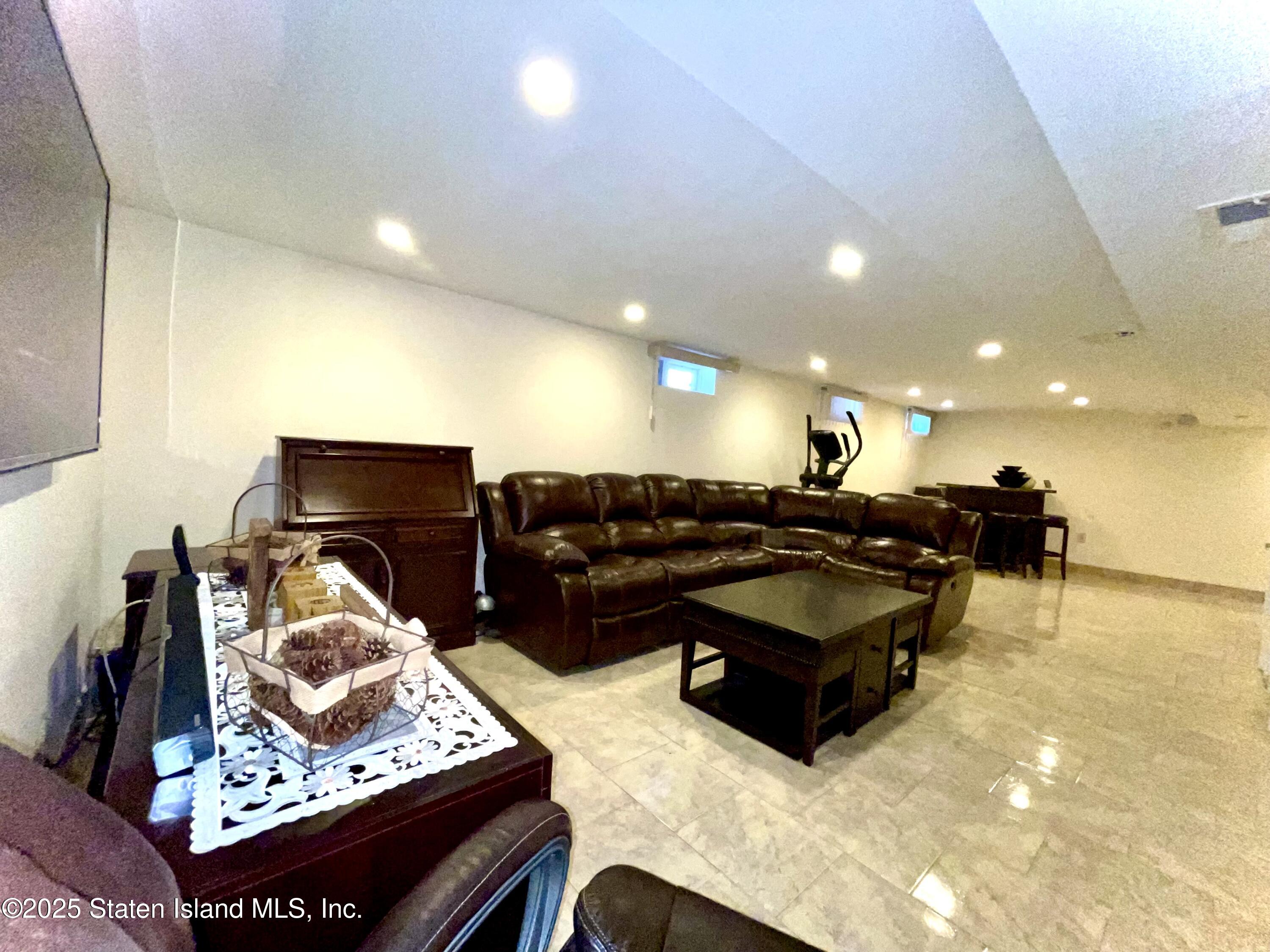 10 Token Street Staten Island, NY 10312 - Photo 34 of 39 a room with furniture pool and view kitchen