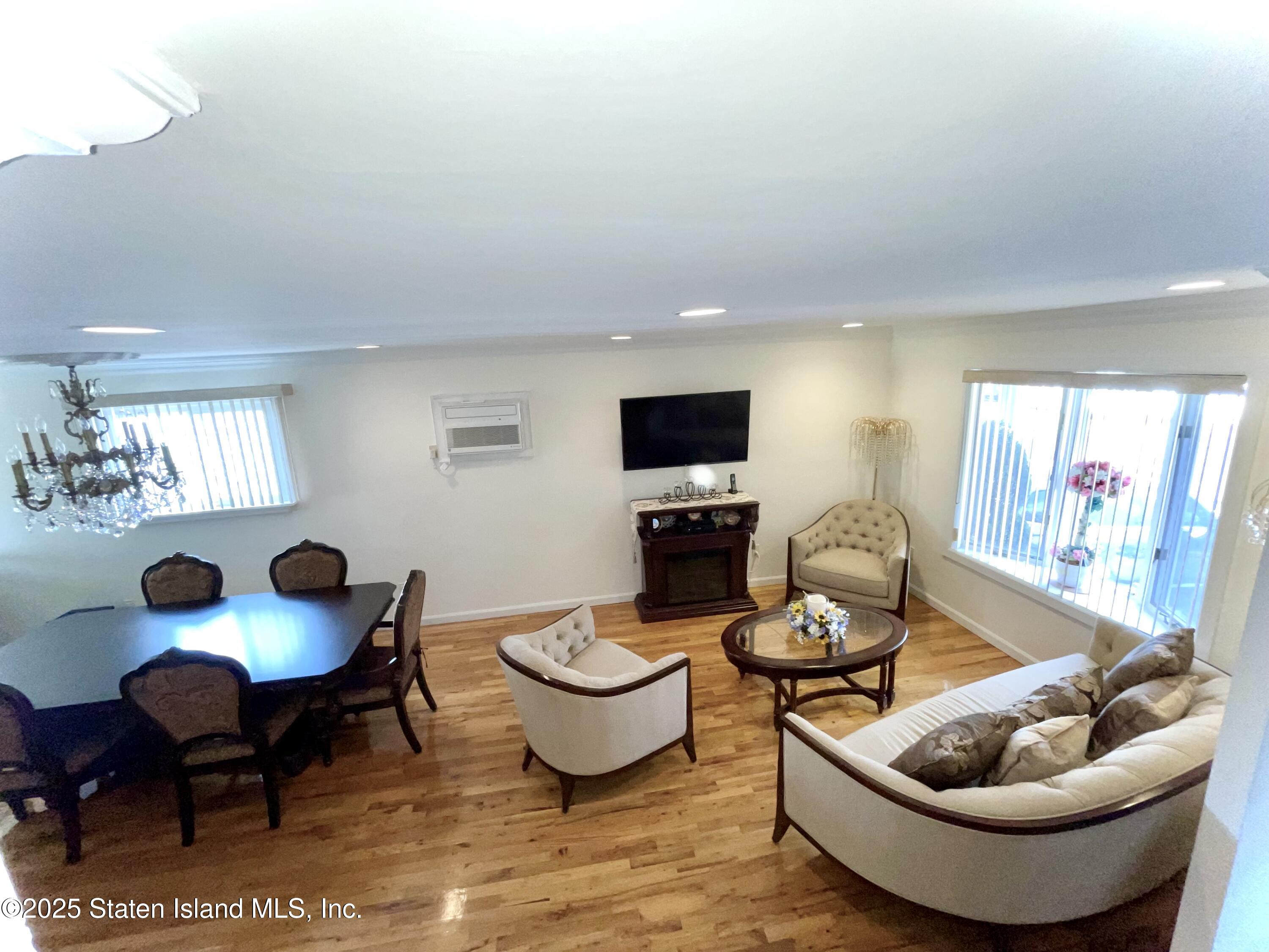 10 Token Street Staten Island, NY 10312 - Photo 5 of 39 a living room with furniture and a flat screen tv
