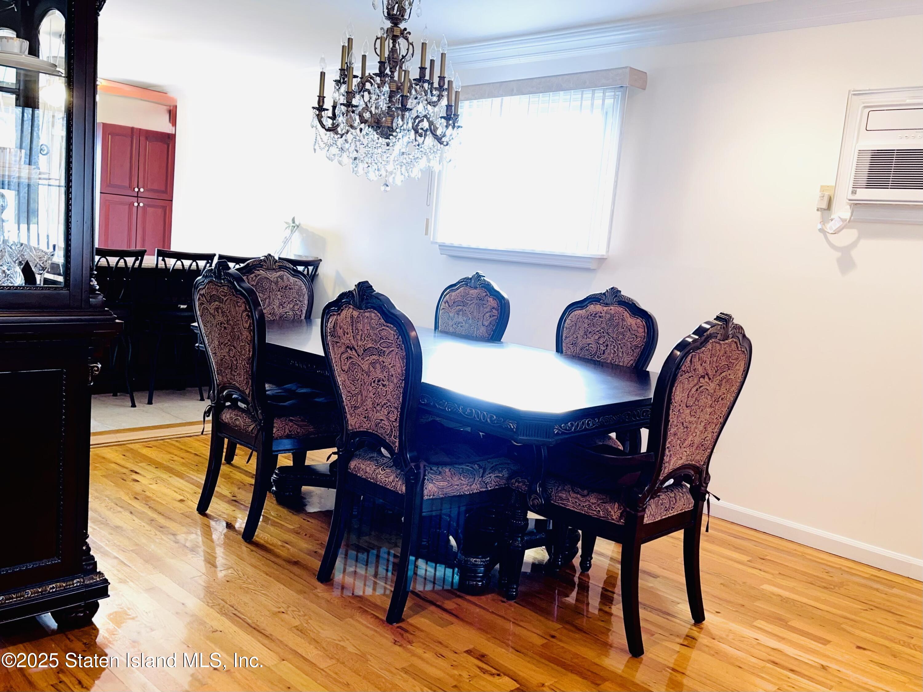 10 Token Street Staten Island, NY 10312 - Photo 7 of 39 a view of a dining room with furniture and wooden floor