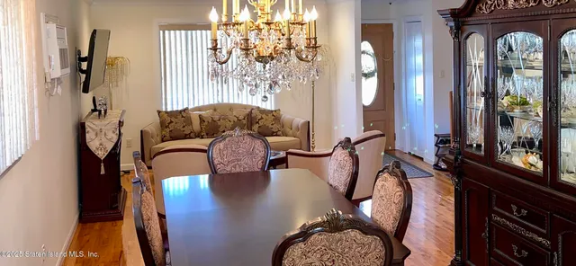 a kitchen with granite countertop a stove a sink and a microwave