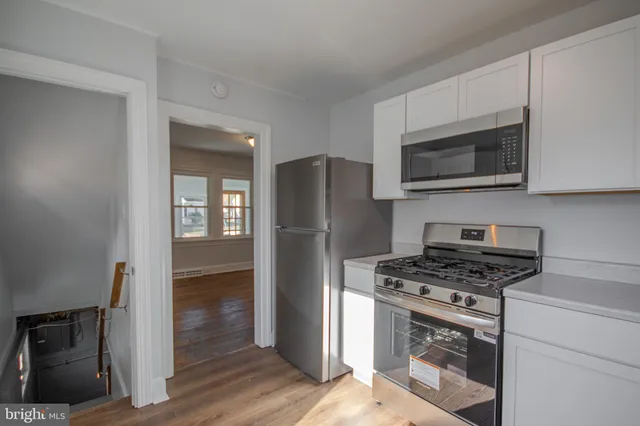 a kitchen with a stove microwave and refrigerator