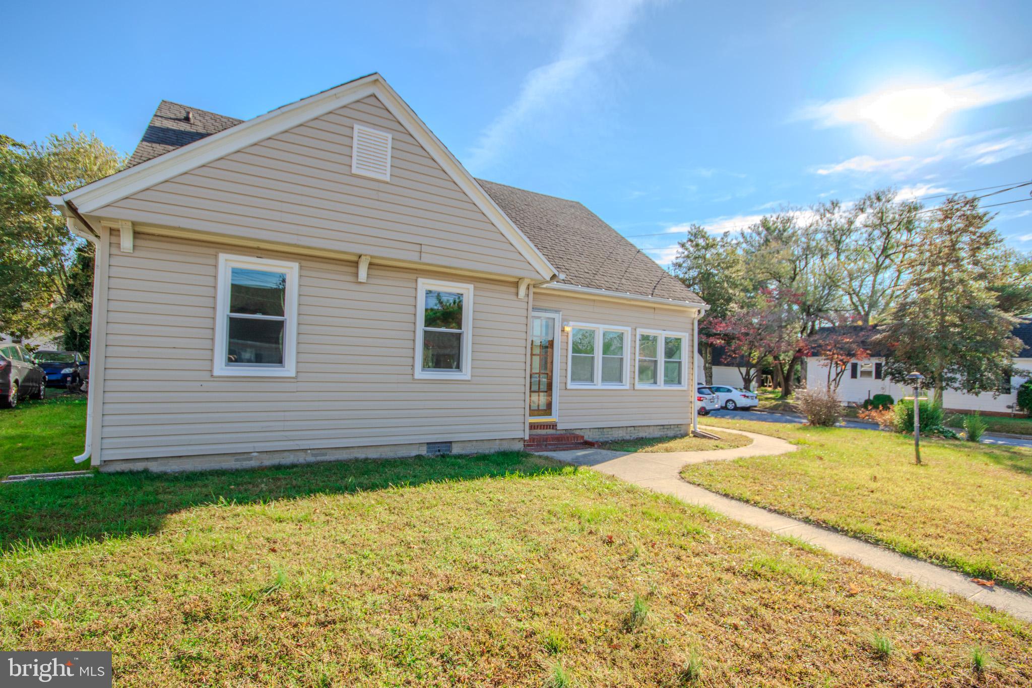 131 Truitt Street Salisbury, MD 21804 - Photo 2 of 29 a front view of a house with a garden and yard