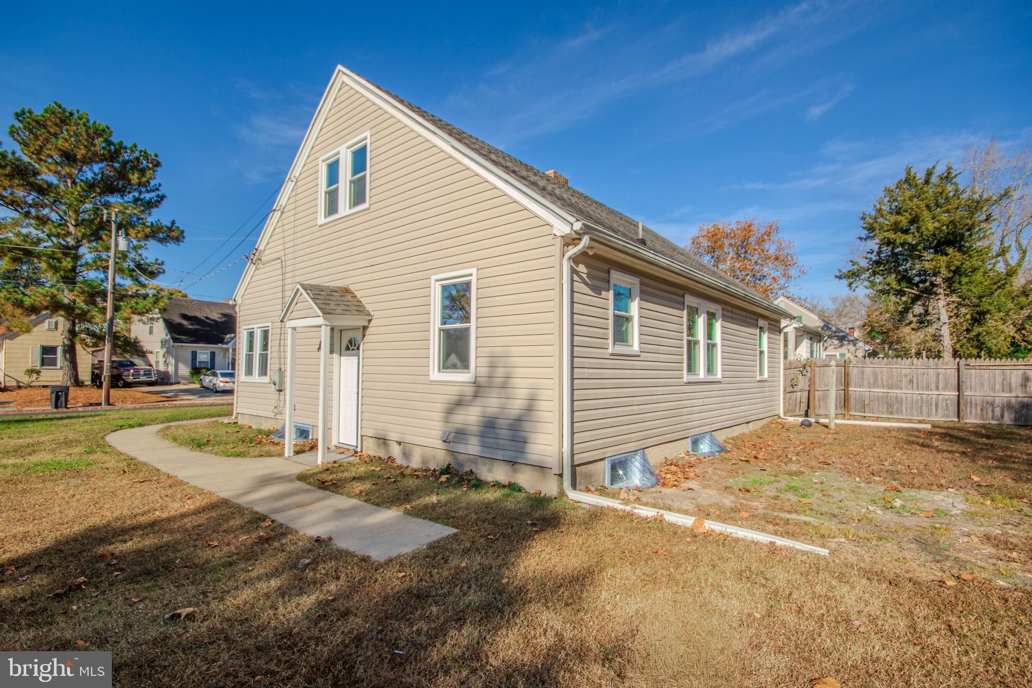 131 Truitt Street Salisbury, MD 21804 - Photo 26 of 29 a front view of a house with a yard covered with snow