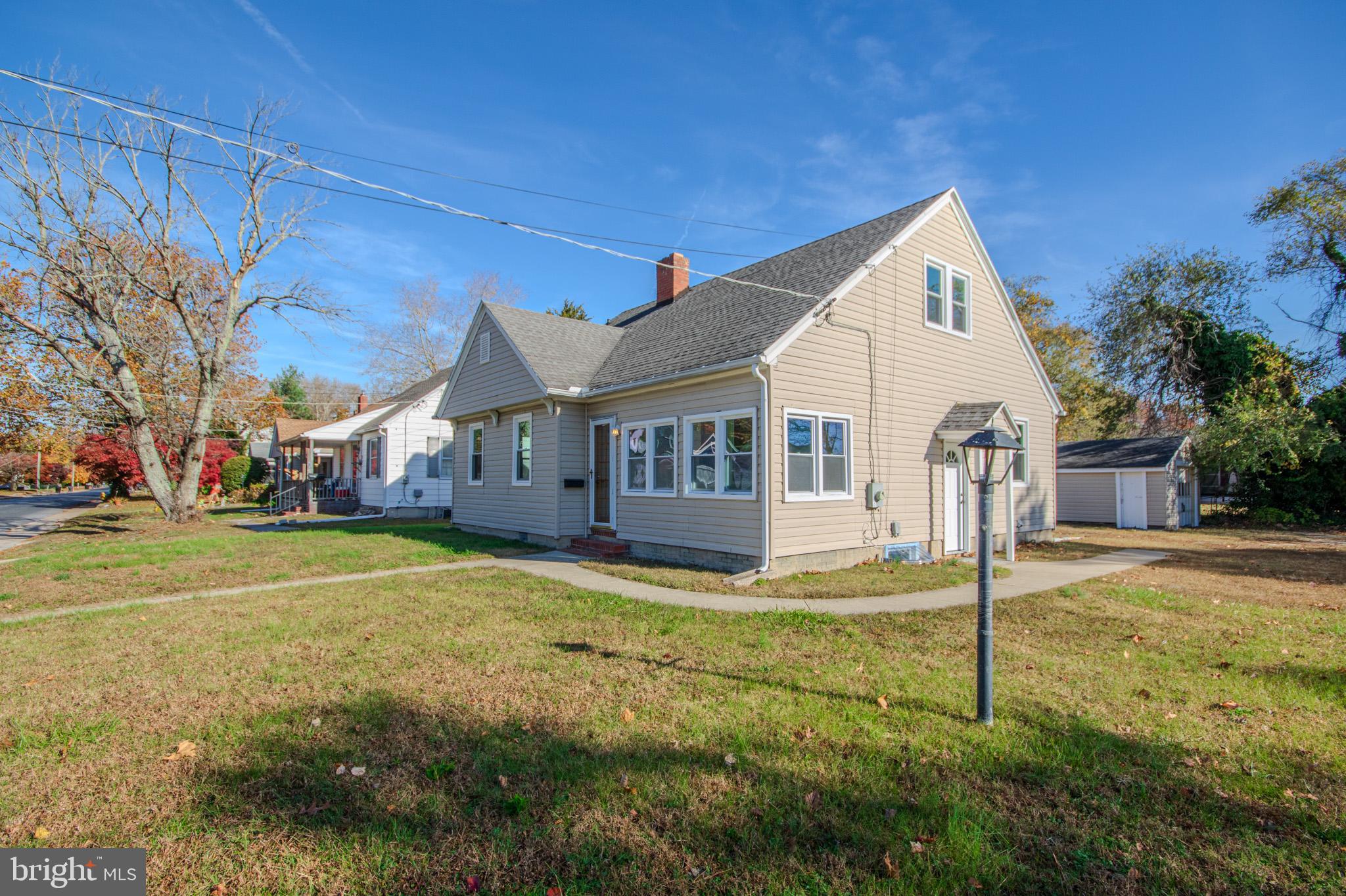 131 Truitt Street Salisbury, MD 21804 - Photo 3 of 29 a view of a house with a big yard and large trees