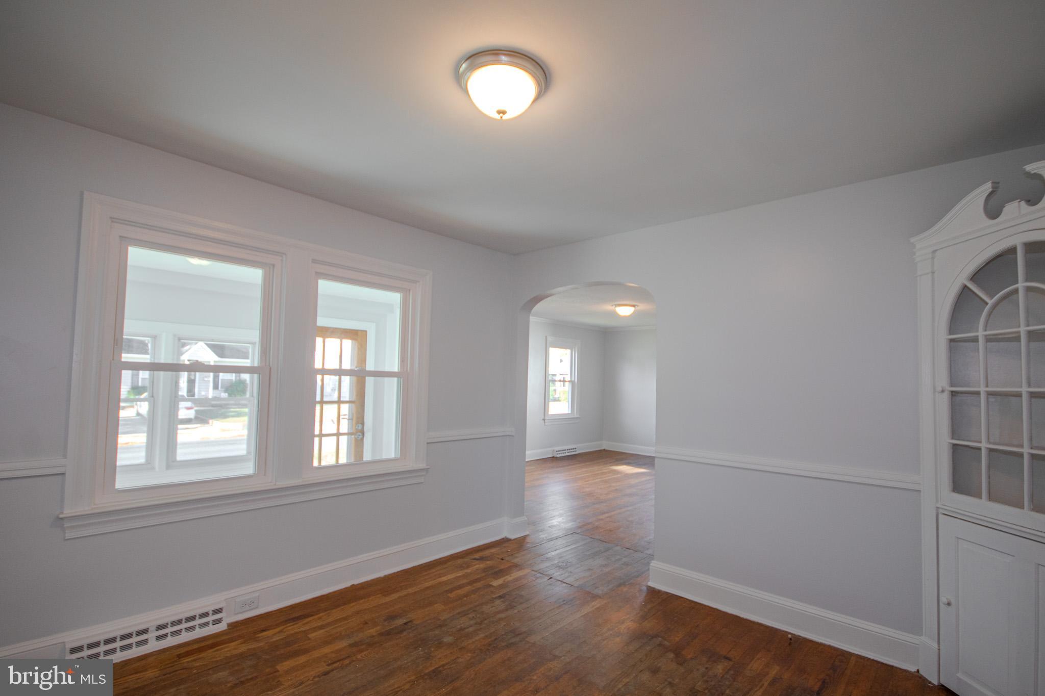 131 Truitt Street Salisbury, MD 21804 - Photo 10 of 29 an empty room with wooden floor and windows