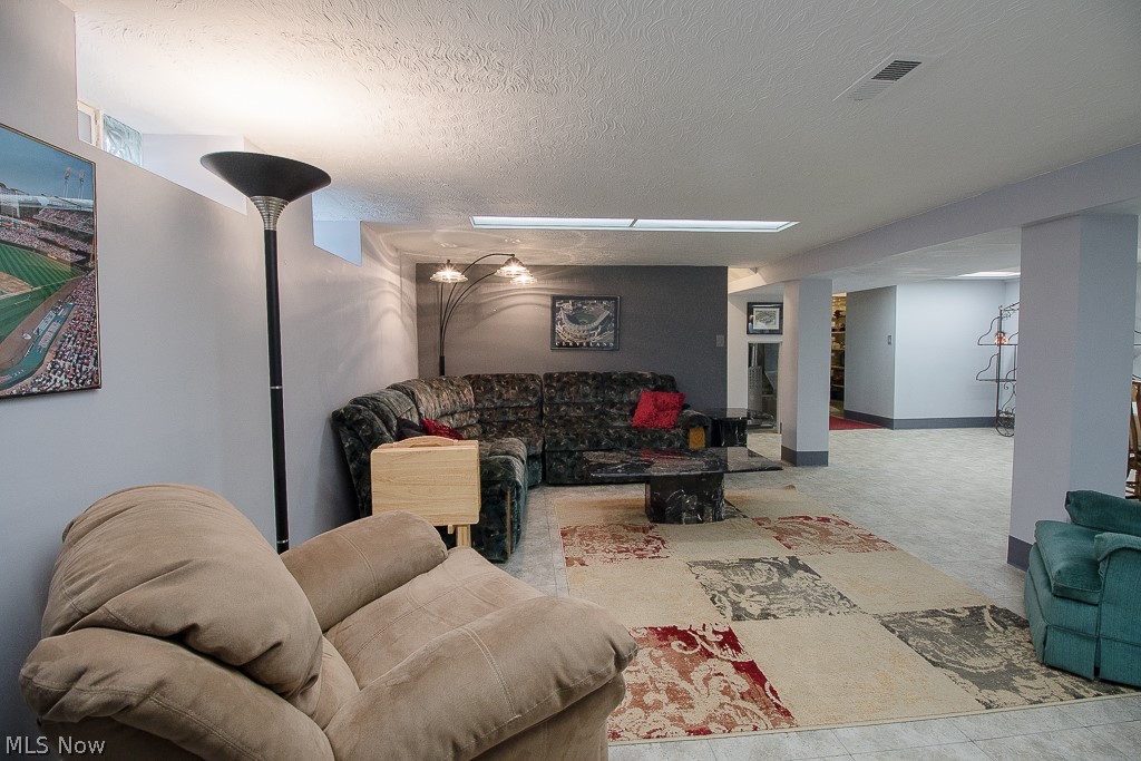 30425 Vineyard Road Willowick, OH 44095 - Photo 12 of 22 The Finished Basement Recreation Room offers a truly great space to spread out. Friends and family will be amazed by the spaciousness during gatherings and parties!