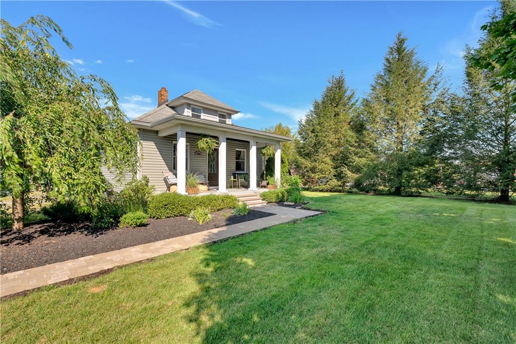 2085 Ridge Rd Extension Ambridge, PA 15003 - Photo 2 of 25 a front view of a house with a yard