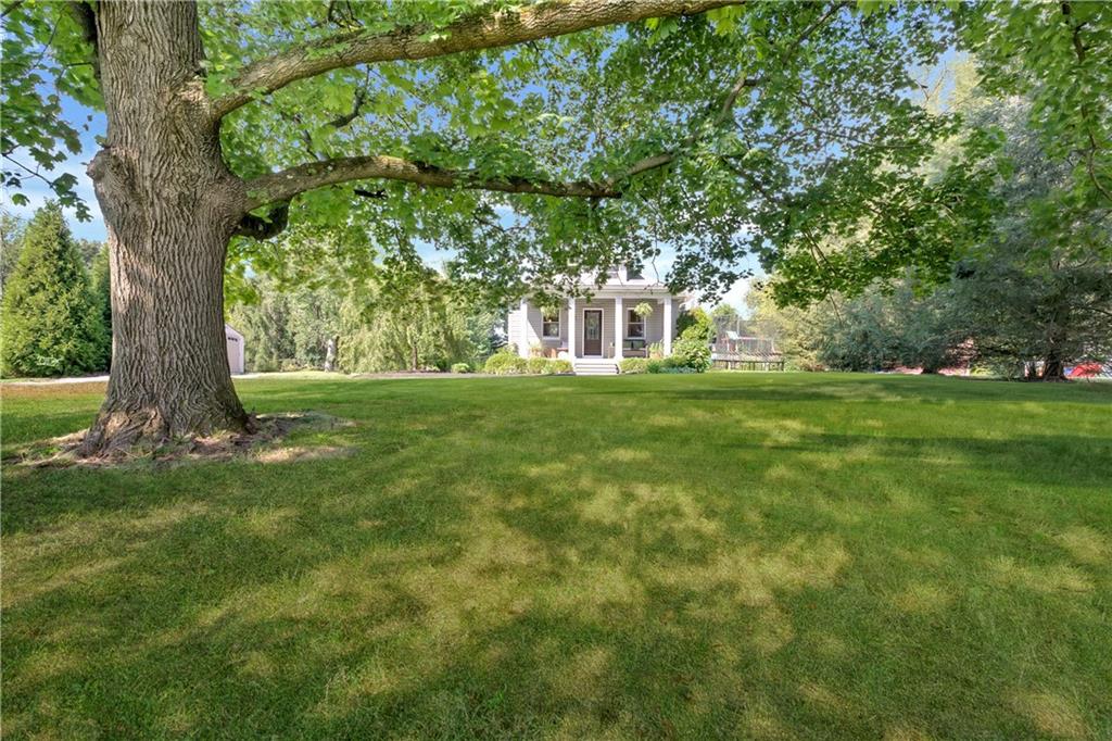 2085 Ridge Rd Extension Ambridge, PA 15003 - Photo 4 of 25 a view of a house with a big yard and large trees