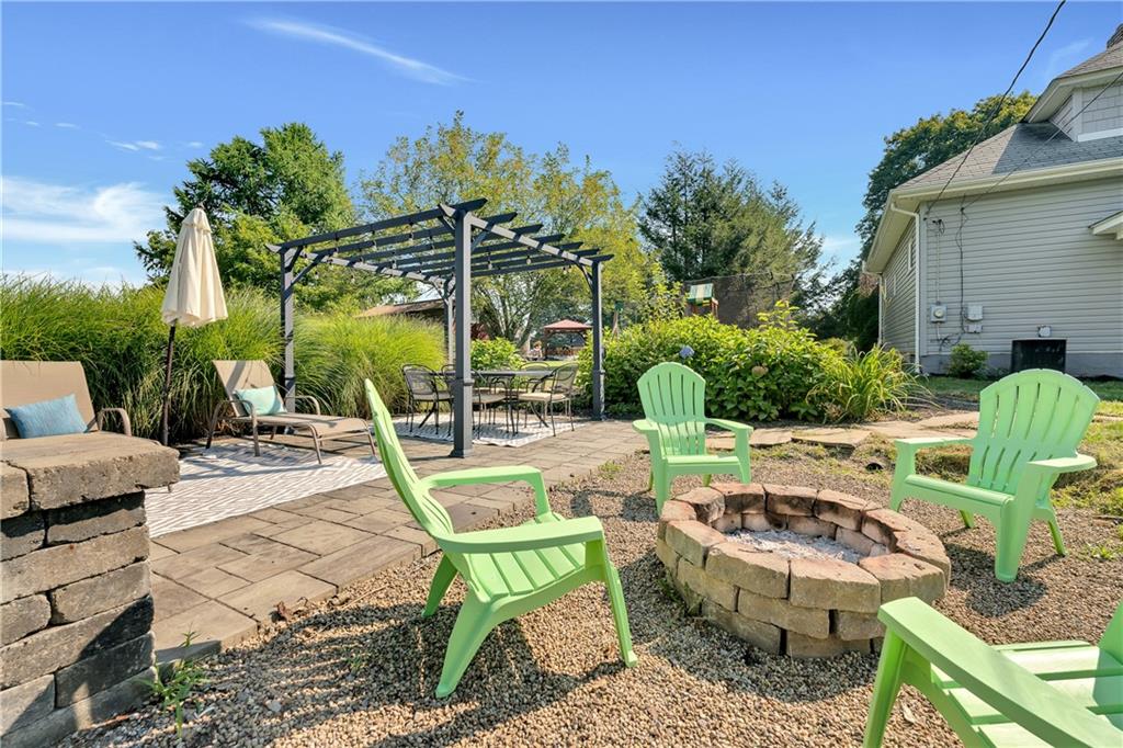 2085 Ridge Rd Extension Ambridge, PA 15003 - Photo 9 of 25 a view of a chair and tables in the patio
