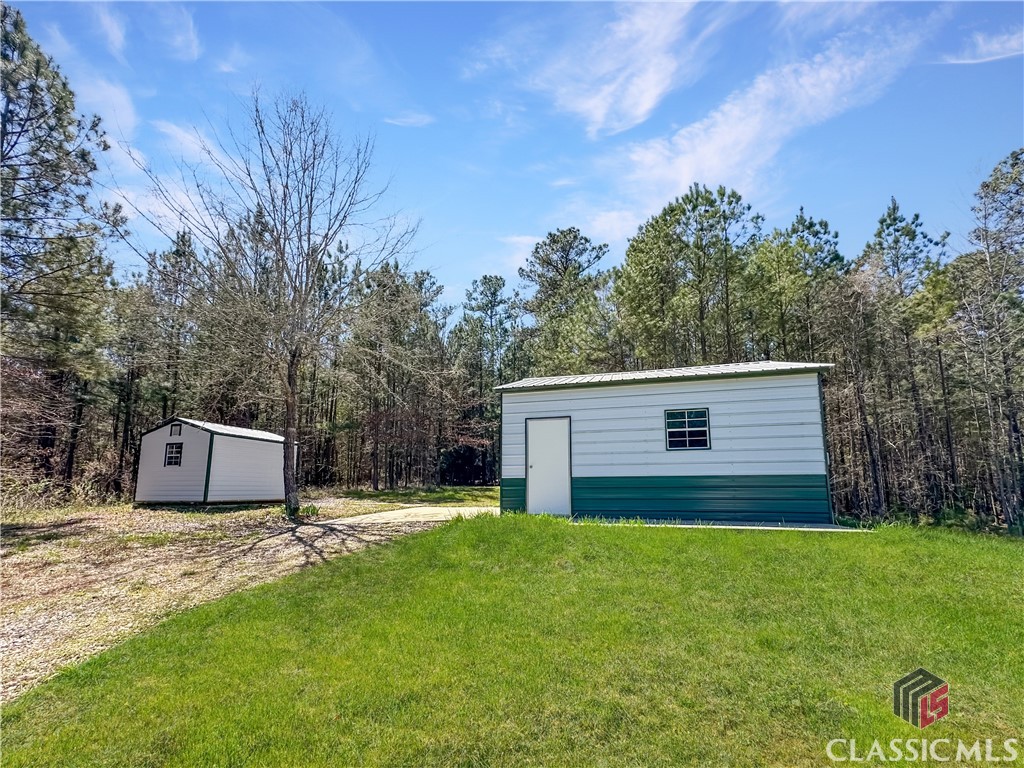 855 Steven's Grove Church Road Lexington, GA 30648 - Photo 29 of 51 Garage on slab w/power, garage & side door