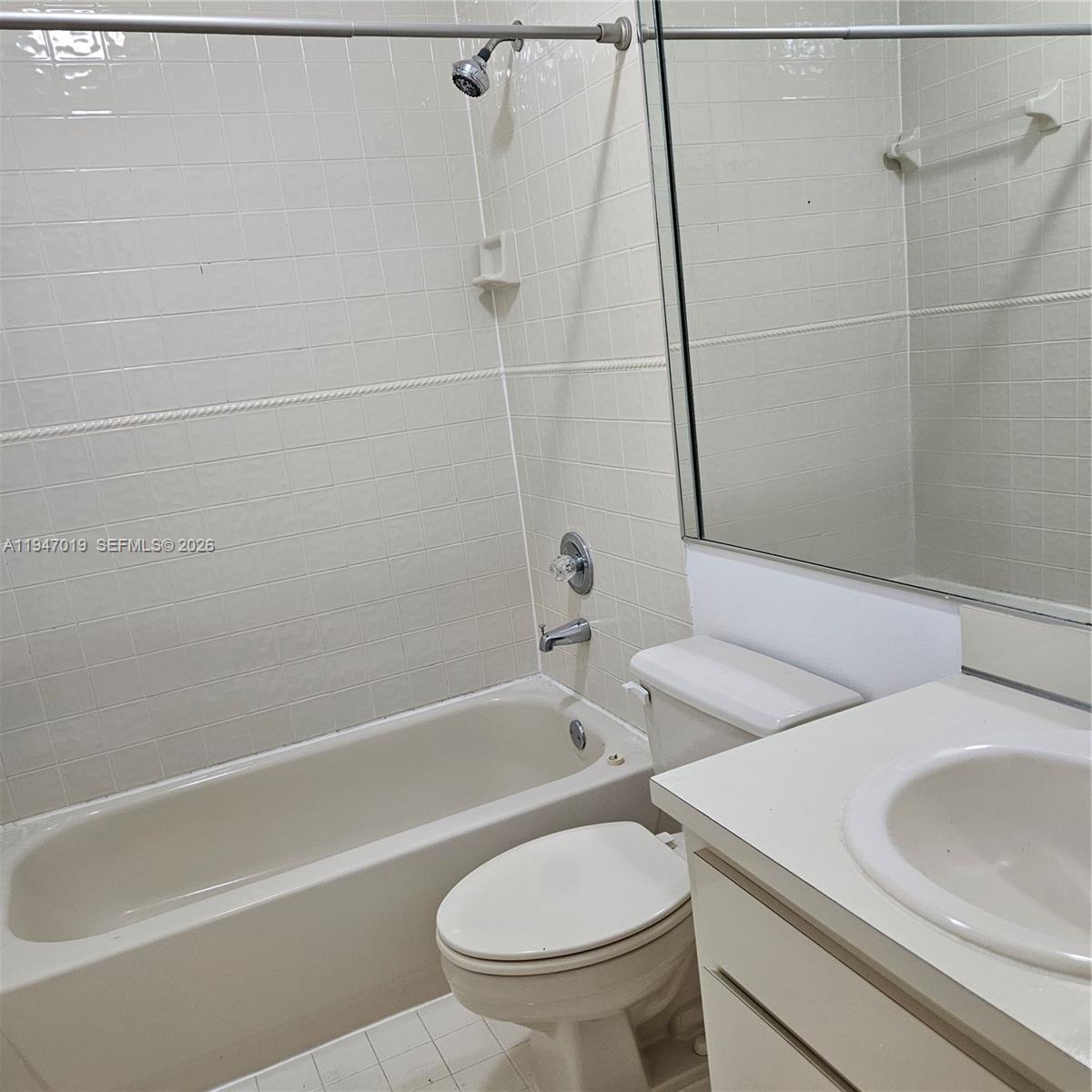 6309 Southwest 138th Place Miami, FL 33183 - Photo 12 of 17 a bathroom with a sink a toilet and a bathtub
