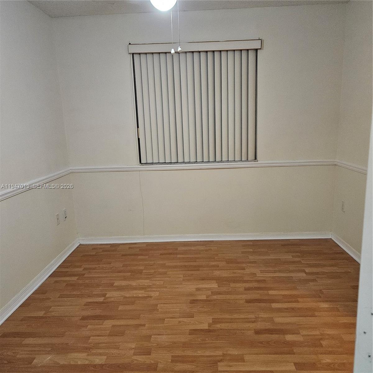 6309 Southwest 138th Place Miami, FL 33183 - Photo 14 of 17 a view of a room with wooden floor