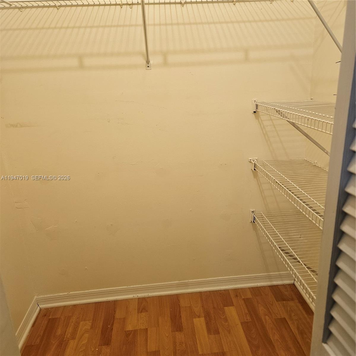 6309 Southwest 138th Place Miami, FL 33183 - Photo 15 of 17 a view of small space with racks on the wall