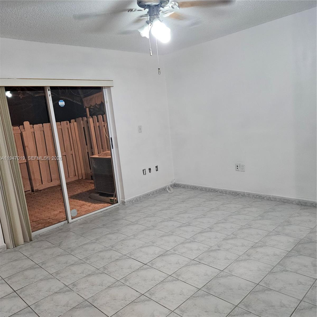 6309 Southwest 138th Place Miami, FL 33183 - Photo 4 of 17 an empty room with windows