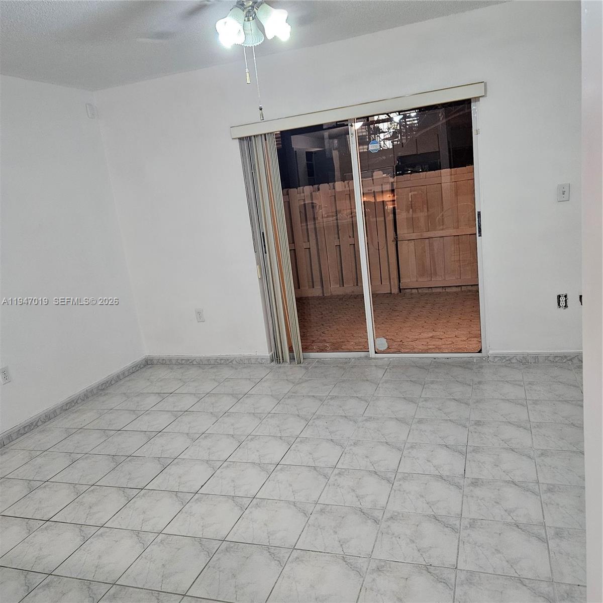 6309 Southwest 138th Place Miami, FL 33183 - Photo 5 of 17 an empty room with windows