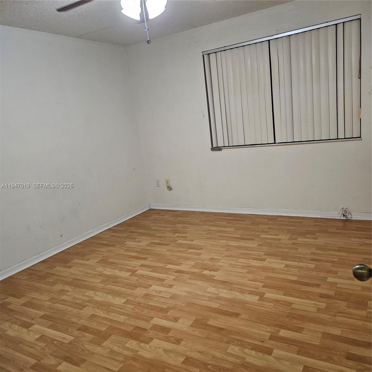 6309 Southwest 138th Place Miami, FL 33183 - Photo 10 of 17 a view of an empty room with a window