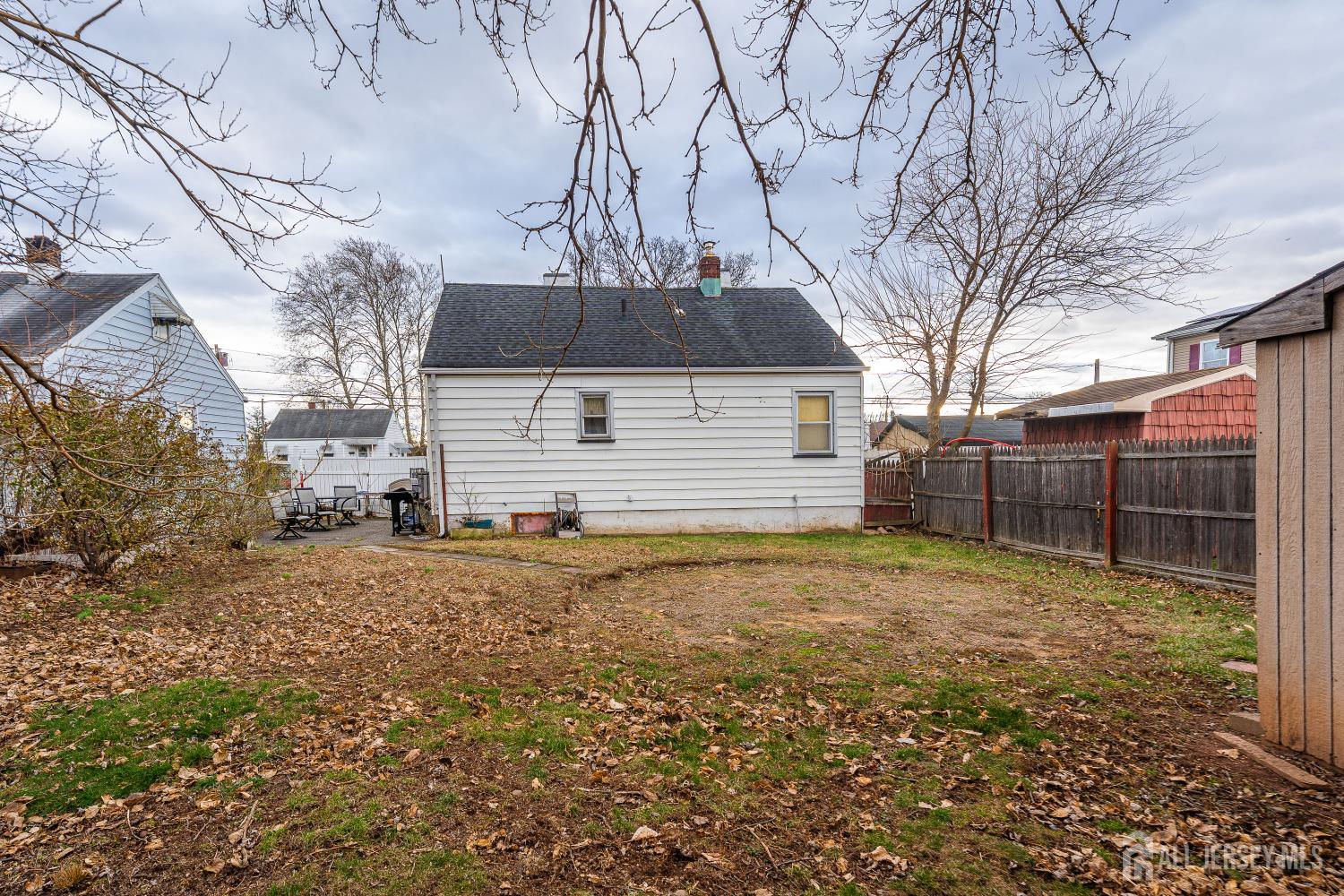 81 Larch Street Port Reading, NJ 07064 - Photo 19 of 25 a view of a backyard with large trees
