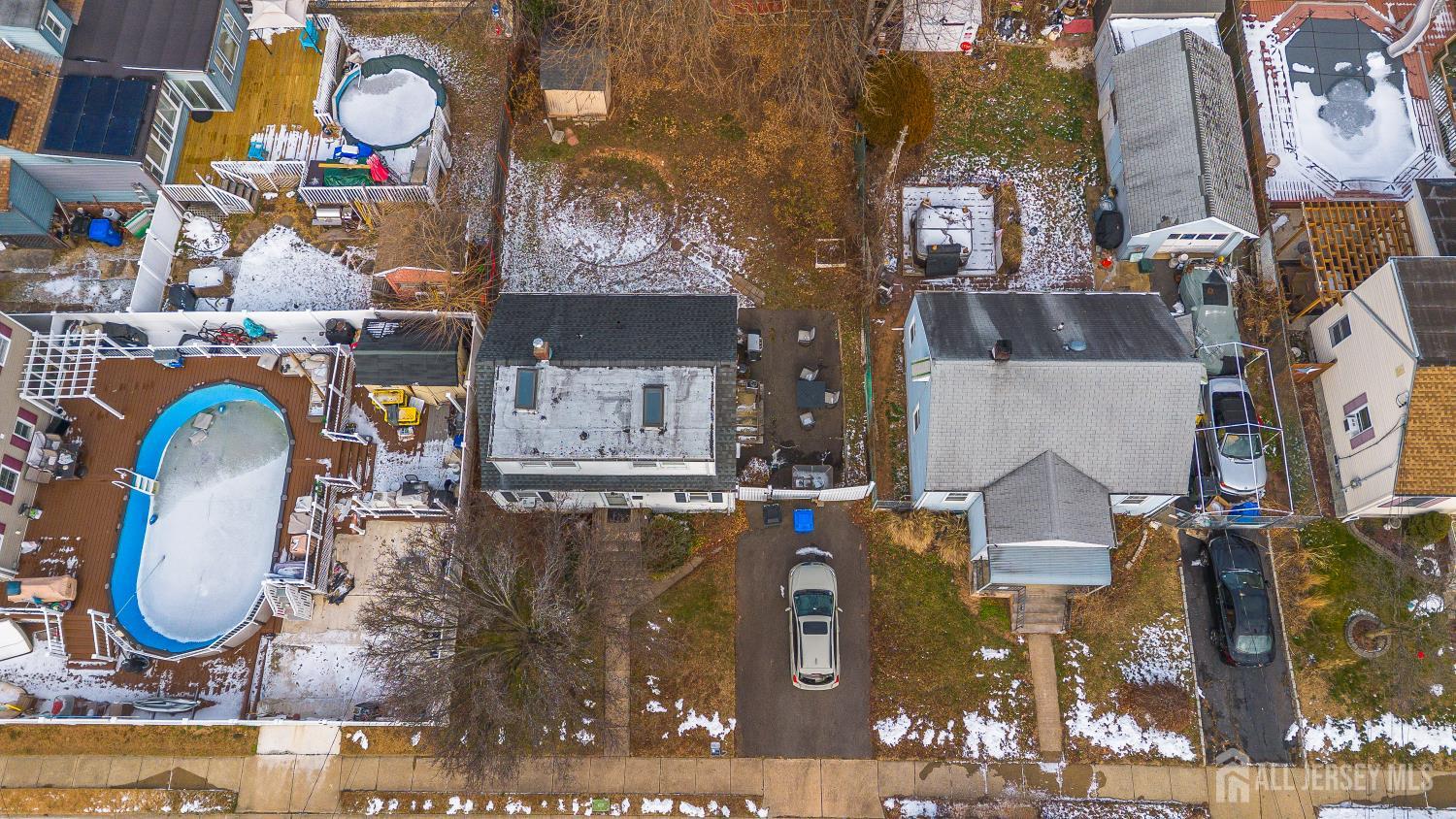 81 Larch Street Port Reading, NJ 07064 - Photo 21 of 25 an aerial view of a house with swimming pool