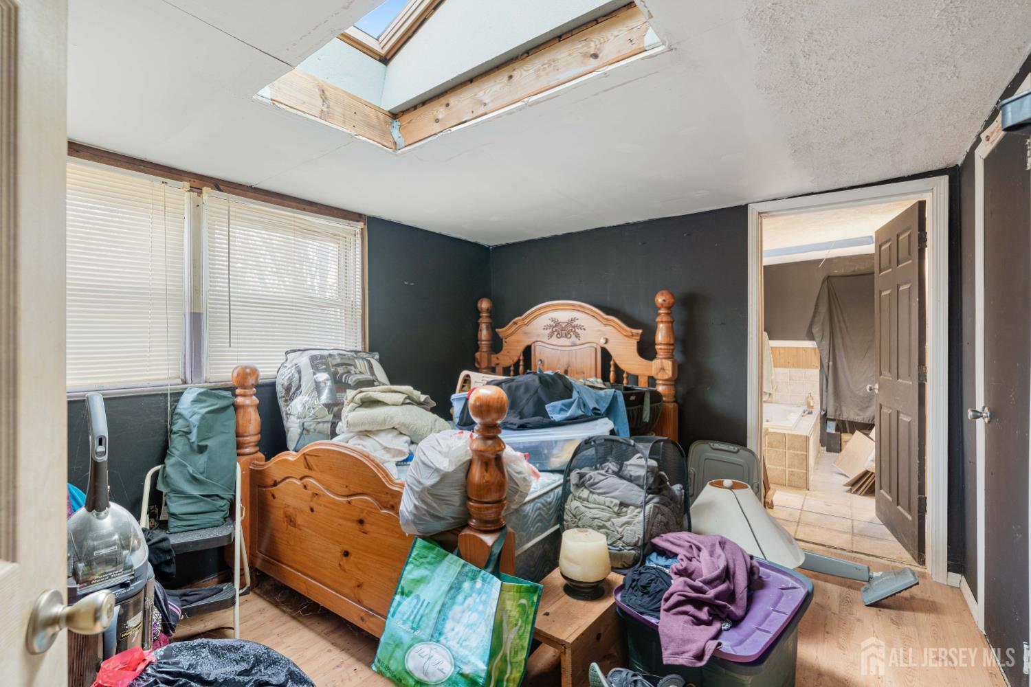 81 Larch Street Port Reading, NJ 07064 - Photo 10 of 25 a living room with furniture a rug and a window