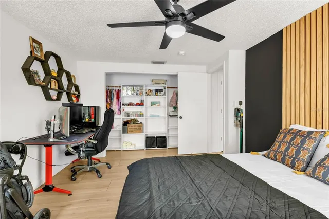 a bedroom with furniture and a bed