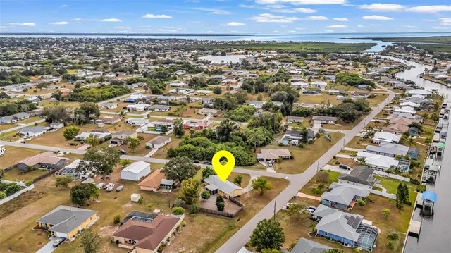 an aerial view of residential houses with outdoor space