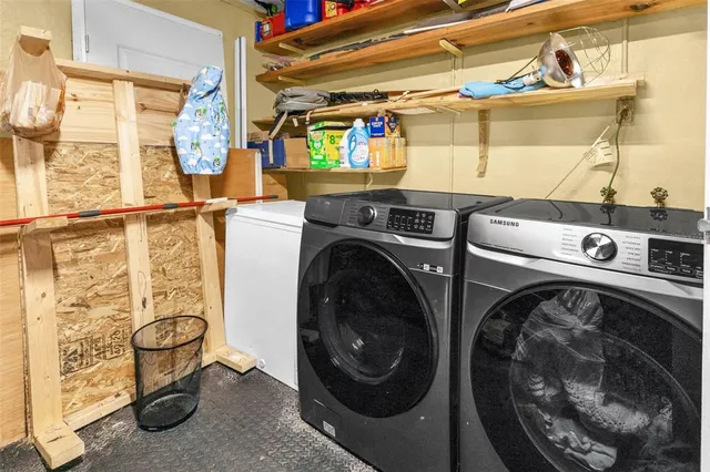 a utility room with dryer and washer