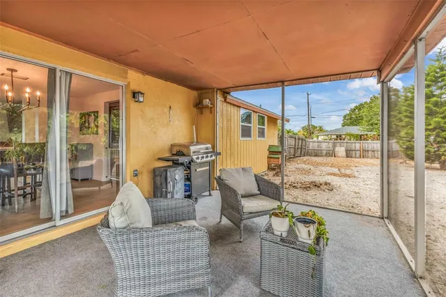 a outdoor living space with patio furniture and a potted plant