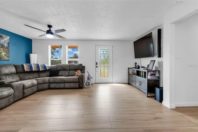 a living room with furniture and a flat screen tv