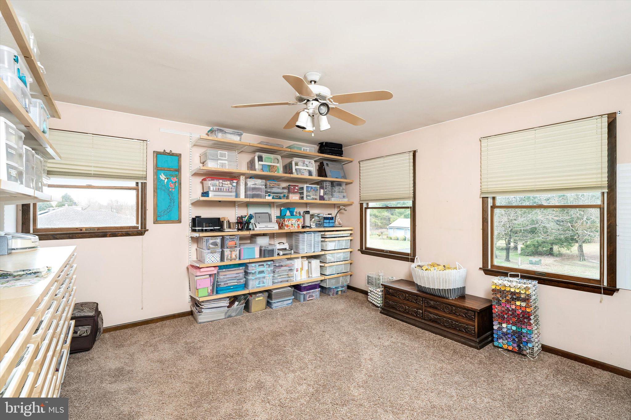 3 Eleanor Drive Wrightstown, NJ 08562 - Photo 17 of 28 a living room with furniture and a book shelf