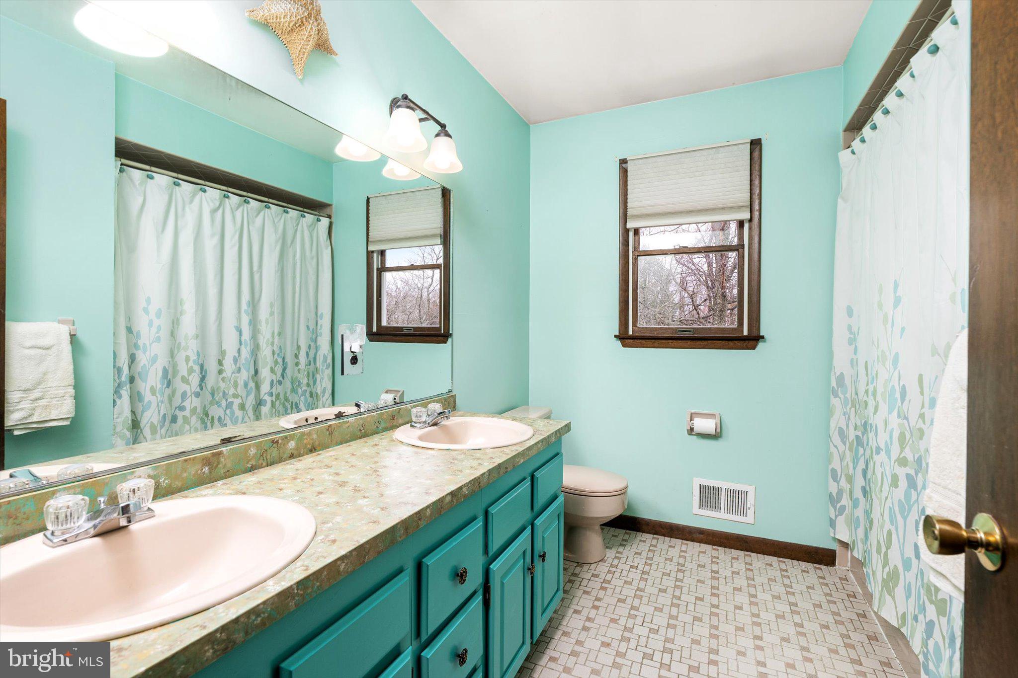 3 Eleanor Drive Wrightstown, NJ 08562 - Photo 19 of 28 a bathroom with a double vanity sink and a mirror