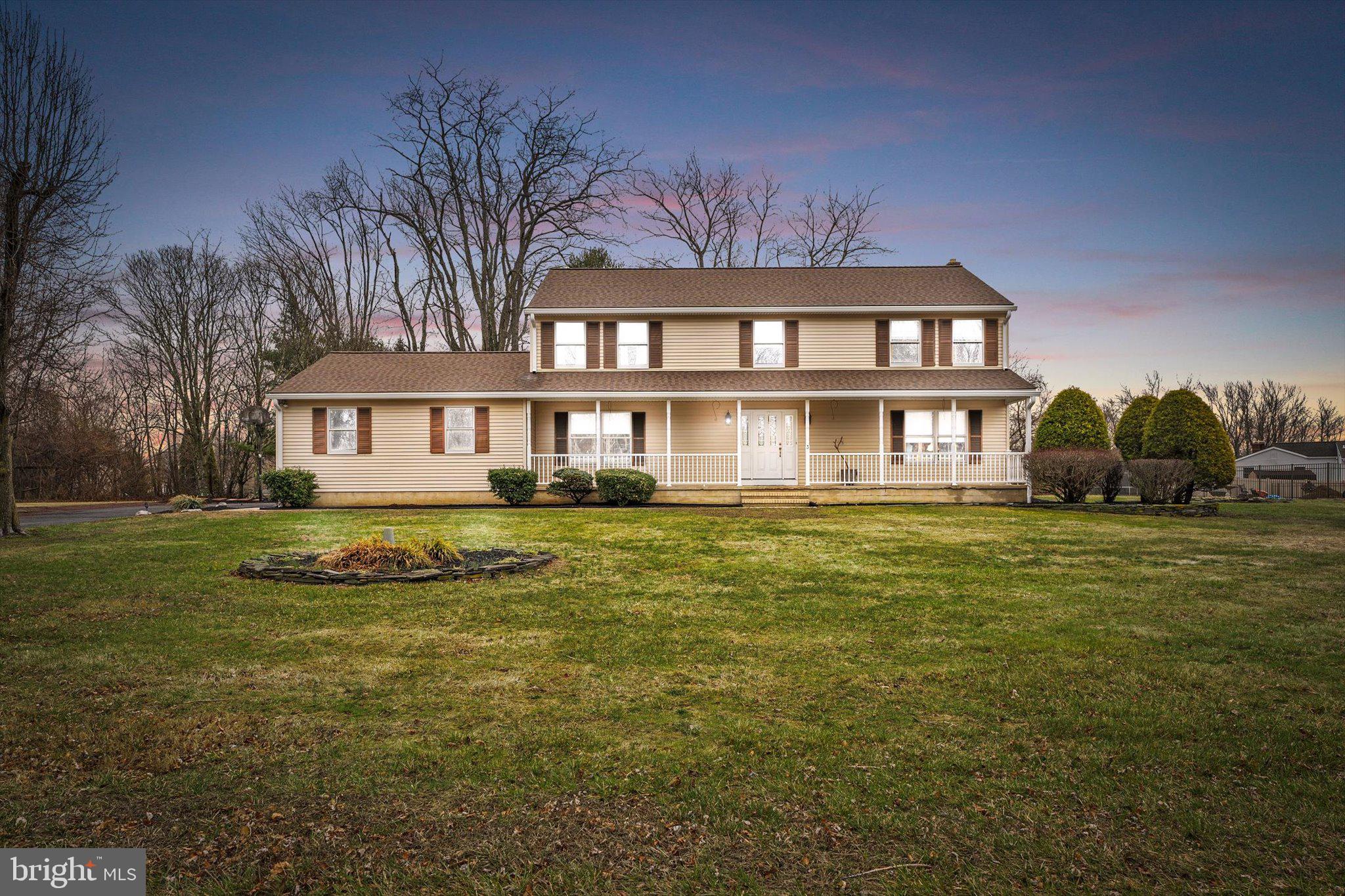 3 Eleanor Drive Wrightstown, NJ 08562 - Photo 2 of 28 a large pool that has lawn chairs with plants and trees