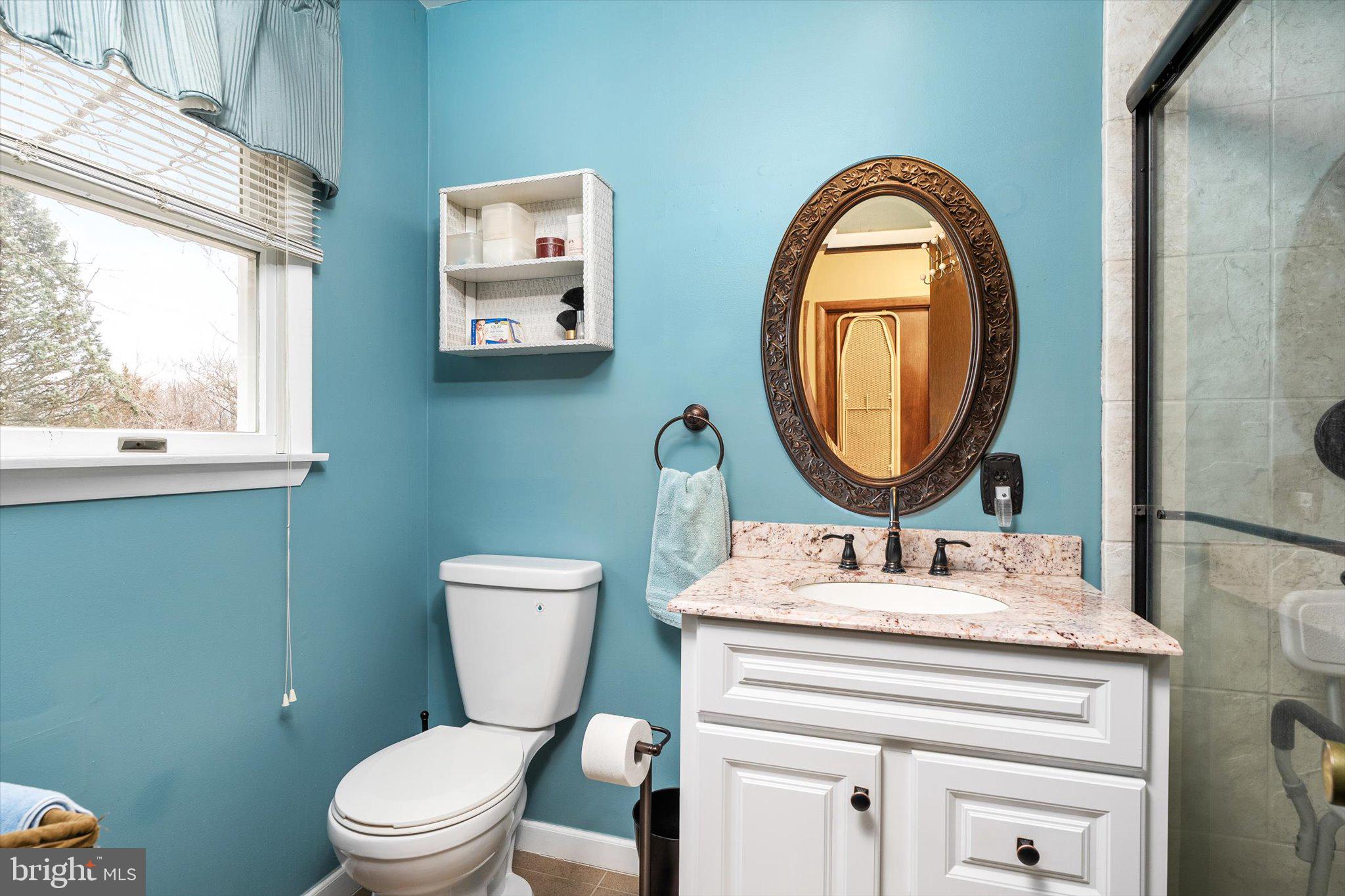3 Eleanor Drive Wrightstown, NJ 08562 - Photo 23 of 28 a bathroom with a toilet a sink and a mirror