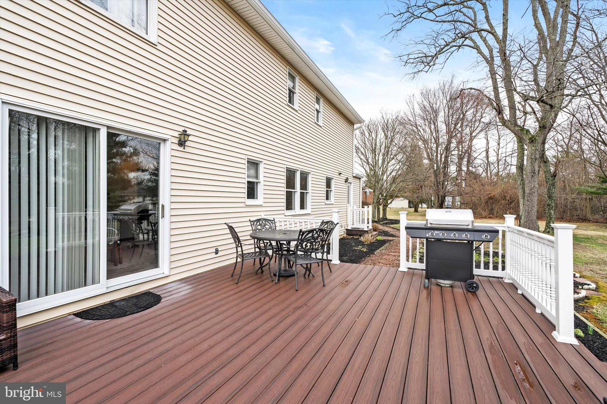 3 Eleanor Drive Wrightstown, NJ 08562 - Photo 26 of 28 a view of a roof deck with table and chairs and wooden floor