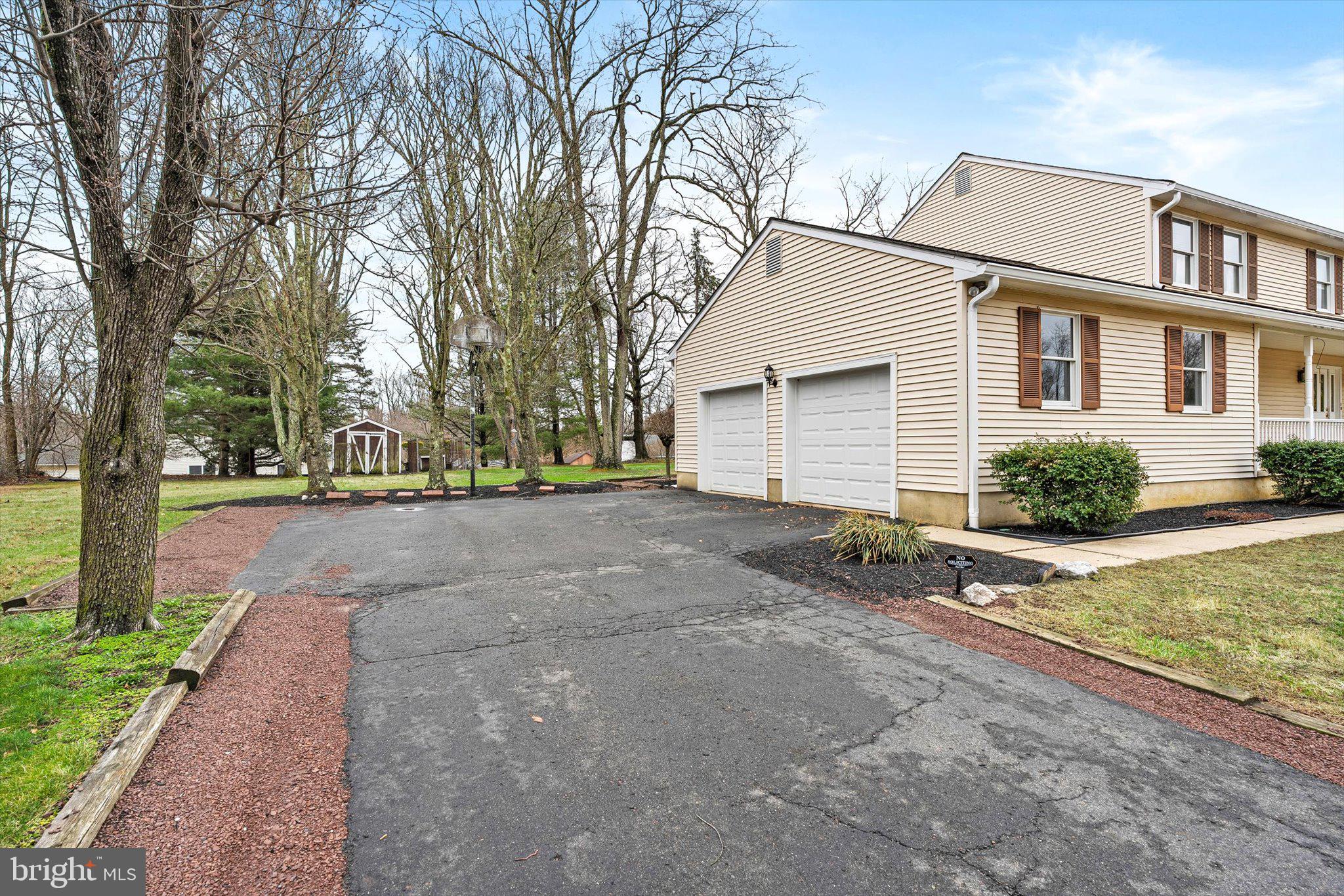 3 Eleanor Drive Wrightstown, NJ 08562 - Photo 3 of 28 a front view of a house with a yard and garage