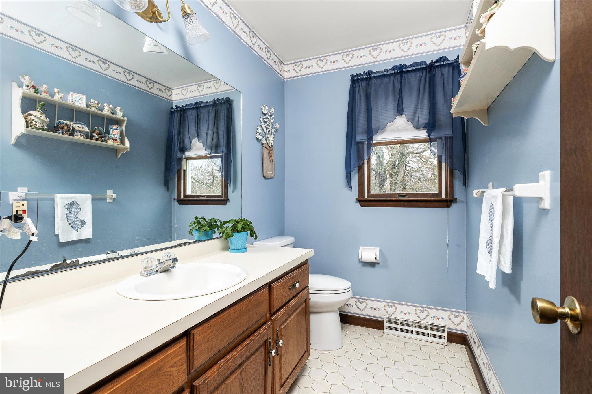 3 Eleanor Drive Wrightstown, NJ 08562 - Photo 10 of 28 a bathroom with a sink a toilet and mirror